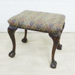 Mahogany stool with upholstered seat, acanthus carved cabriole legs and on claw and ball feet, 48