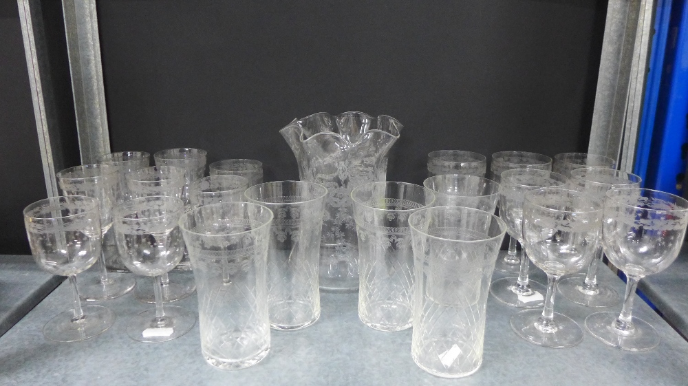 Collection of early 20th century star etched drinking glasses and a frilled rim vase of similar