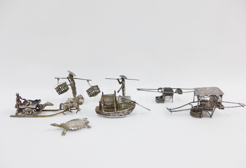 Seven various Chinese silver and white metal figures together with a boat, rickshaw and turtle,