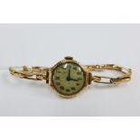 Lady's vintage 9ct gold cased wrist watch on a 9ct gold bracelet strap