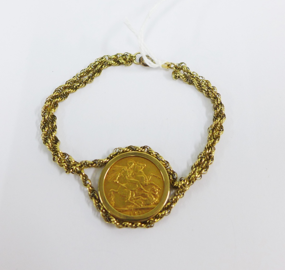 Queen Victoria gold sovereign 1874 in a 9ct gold mount and bracelet