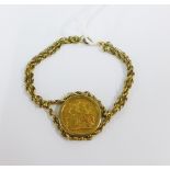 Queen Victoria gold sovereign 1874 in a 9ct gold mount and bracelet