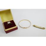 9ct gold ring, child's 9ct gold bangle and a yellow metal gemset bar brooch, (3)