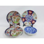 Chinese Imari charger together with a blue and white bowl and a pair of later Japanese plates, (4)