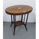 Edwardian rosewood and inlaid two tier occasional table with an oval top, turned legs and castors 71