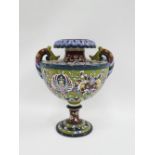 Early 20th century Continental pottery twin handled vase, with flower head rim and bulbous body,