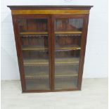 Mahogany bookcase with dentil frieze and pair of glazed doors, with a shelved interior, 155 x 123cm