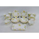 Delphine bone china teaset, nine cups, ten saucers, eleven side plates, cream jug , sugar bowl and