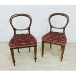 Pair of Victorian mahogany balloon back chairs with button upholstered seats and turned legs, 84 x