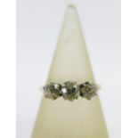 18ct gold diamond ring, claw set with three bright cut diamonds, stamped 18ct