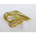 18ct gold Feather Leaf brooch set with graduated diamonds along the spines, stamped 750, approx 18.