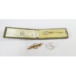14ct white gold brooch of circular form set with seed pearls, together with an unmarked gold bar