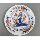 Chinese plate painted with underglaze blue foliage pattern, (small chip to rim) 23cm diameter