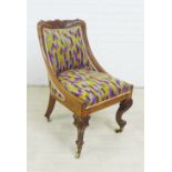 19th century mahogany chair with leaf carved top rail and upholstered slope back and seat, on carved