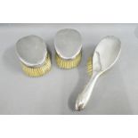 Pair of Gent's Sheffield silver backed clothes brushes and a silver backed hairbrush (3)