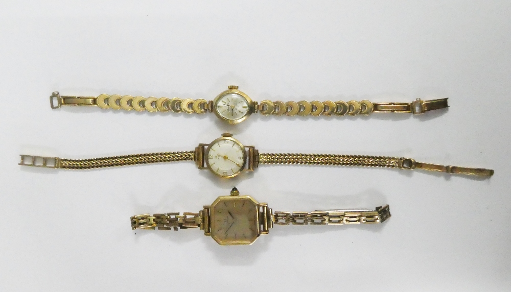 A collection of three lady's vintage wristwatches to include Tissot on a 9ct gold bracelet strap,