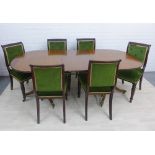 Mahogany twin pedestal dining table with extra leaves and a set of six mahogany button back