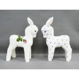 Two Plichta Pottery donkeys, one painted with cabbage roses the other with blue polka dots, with
