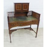 Mahogany and inlaid writing desk with raised back and spindle gallery, over a leather skivver,