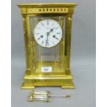 German brass and glass panelled Angelus quarter striking mantle clock, the circular dial with