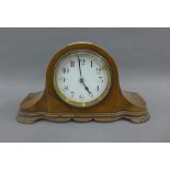 Mahogany framed mantle clock with a French movement, 15cm high