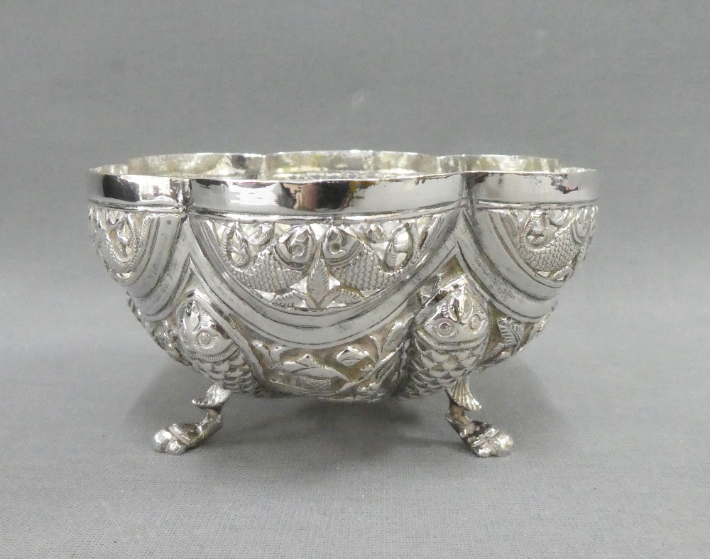 Indian silver bowl with fish and elephant pattern and raised on three hoof feet, unmarked, 12cm