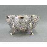 Indian silver bowl with fish and elephant pattern and raised on three hoof feet, unmarked, 12cm