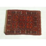 Pakistan rug, the red field with geometric motifs, 120 x 85cm