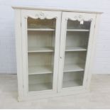 White painted bookcase with pair of glazed doors and shelved interior, 122 x 114cm