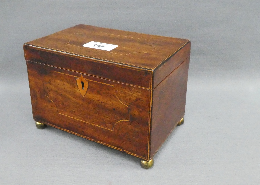 19th century mahogany and inlaid tea caddy with hinged lid and two divisions, on four brass bun