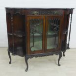 Victorian mahogany cabinet with blind fret frieze over two central glazed doors flanked by open
