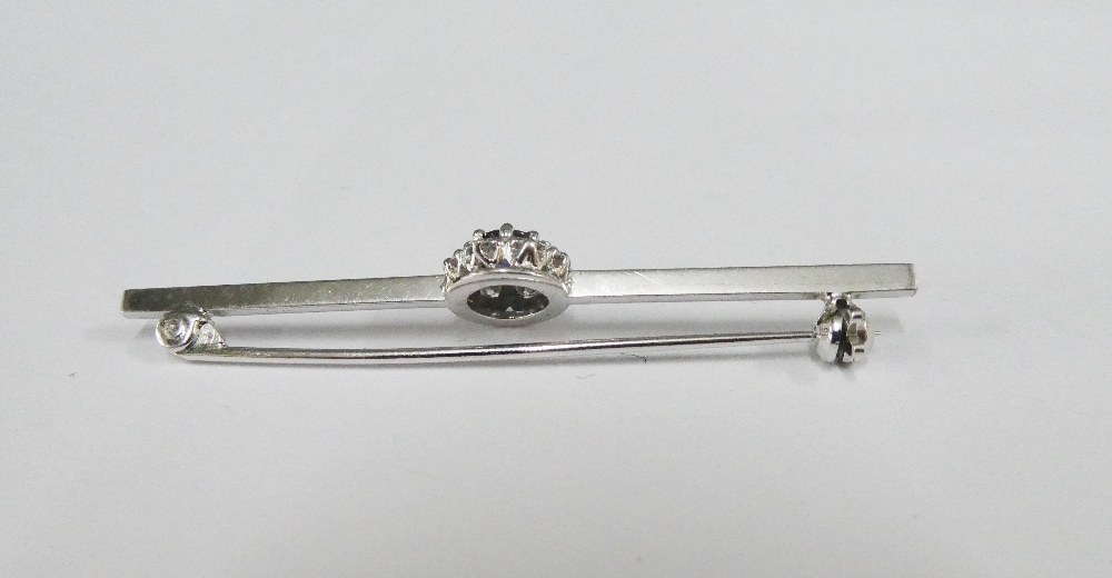 18ct white gold brooch claw set with a central diamond within a surround of ten bright cut diamonds, - Image 2 of 2