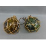 Two coloured glass fishing floats, (2)