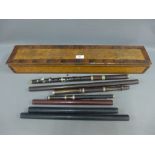 Collection of woodwind instruments contained within a veneered wooden box, (a lot)