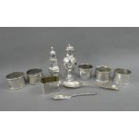 A quantity of silver items to include napkin rings, pepper pots and teaspoon and butter knife,
