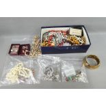 A quantity of silver and costume jewellery to include lockets, beads and bangles, etc, together with