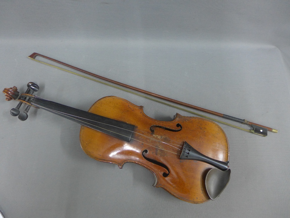 Violin with ornate ornate back and a bow (2)