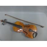 Violin with ornate ornate back and a bow (2)