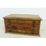 Oak four drawer cabinet, 24 x 52cm