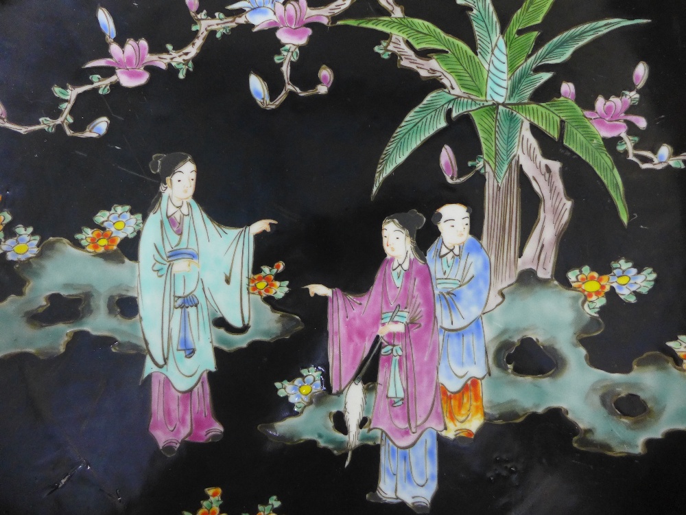 Pair of Chinese chargers, the black ground painted with figures within a yellow border, 40cm - Image 2 of 3