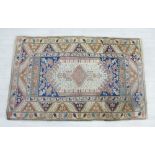 Eastern rug, the ivory field with flowerhead spandrels and multiple borders, 180 x 119cm