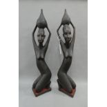Pair of African carved hardwood Ashanti kneeling female figures, 66cm high (2)