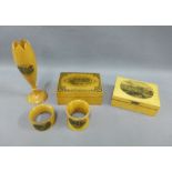 A collection of Mauchline Ware to include a vase, two boxes and two napkin rings (5)
