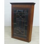 Mahogany corner hanging cupboard with astragal glazed door and shelved interior, 110 x 75cm