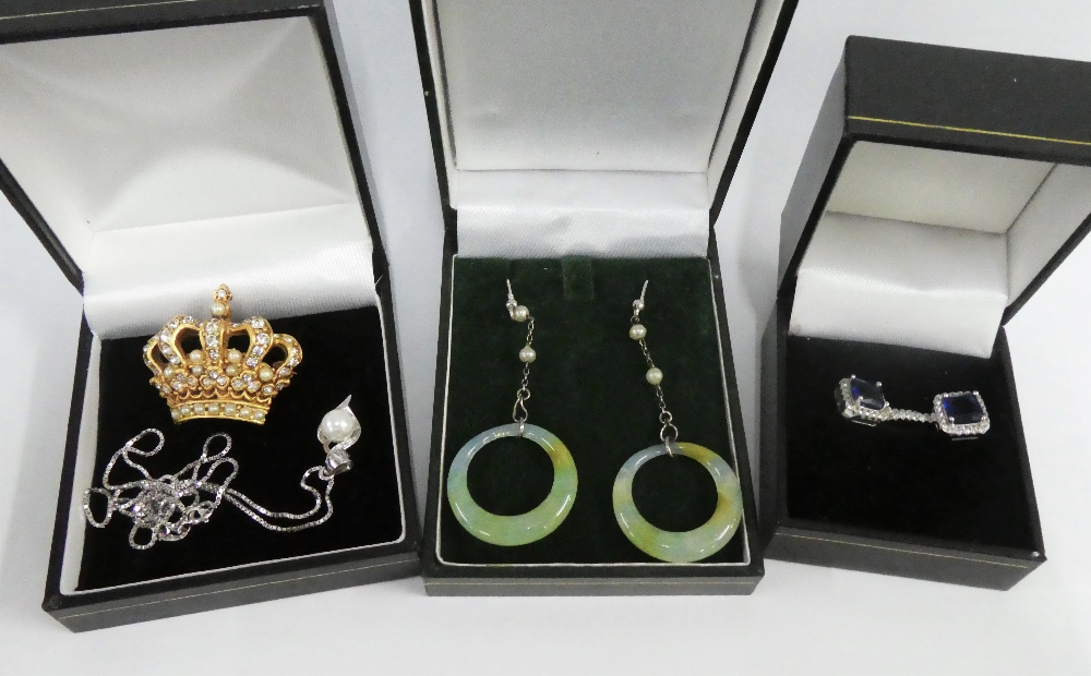 A pair of silver gemset earrings, a silver pendant necklace, green hardstone hoop earrings and a