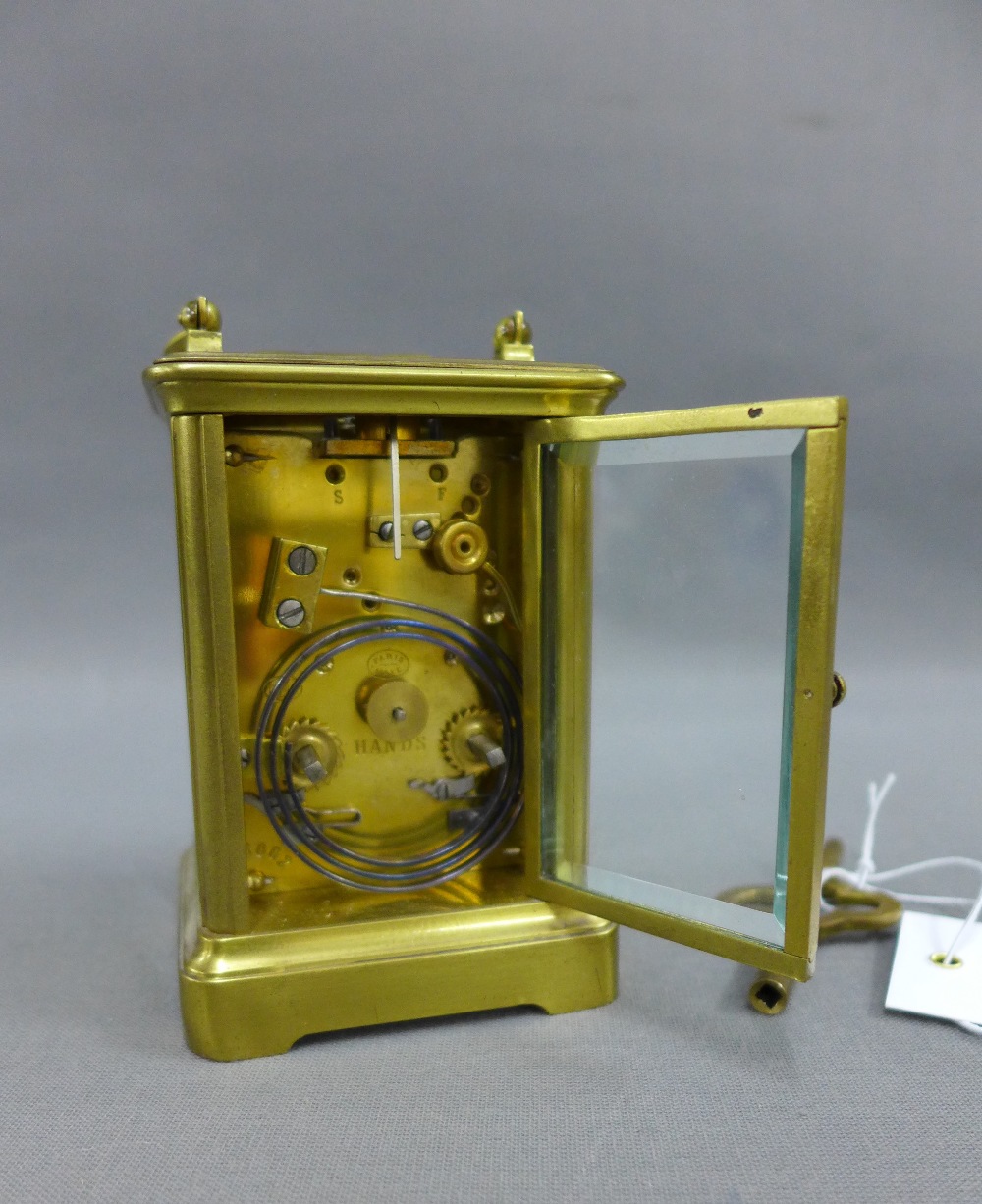 French brass and glass panelled carriage clock of small proportions, the enamel dial with Roman hour - Image 2 of 2