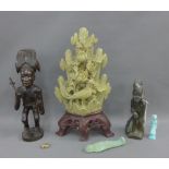 Mixed lot to include a hardwood carved figure, hardstone figure and a carved soapstone group, etc,