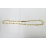 A vintage strand of pearls with a 9ct gold clasp fitting, Birmingham 1960