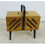 Vintage beech wood three tier concertina sewing box with ebonised strap work and legs, 32 x 42cm