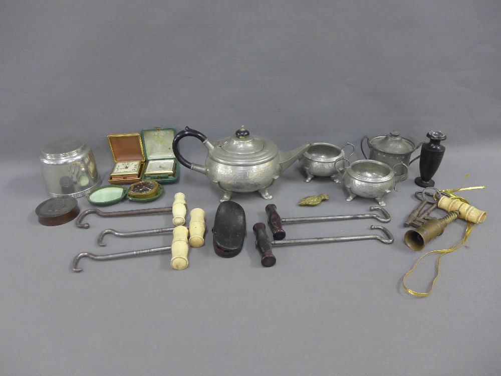 Carton containing a pewter teaset, ivory handed hooks, travel clocks, etc (a lot)